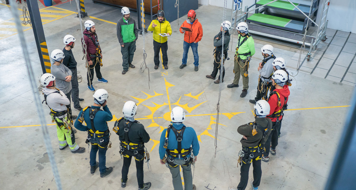 A group of construction workers discuss a safety plan.